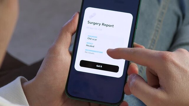 Close-up of a person using a mobile health app to check surgery recovery results. User views a digital report showing a healed status with no issues. Perfect for telemedicine, e-health records, and
