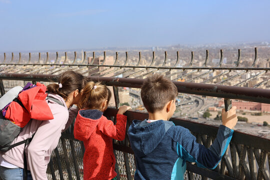 Tourists looking out from the Cairo Tower observation deck, viewing the urban landscape of Cairo, Egypt&rsquo;s capital city and a major destination in the Arab world
