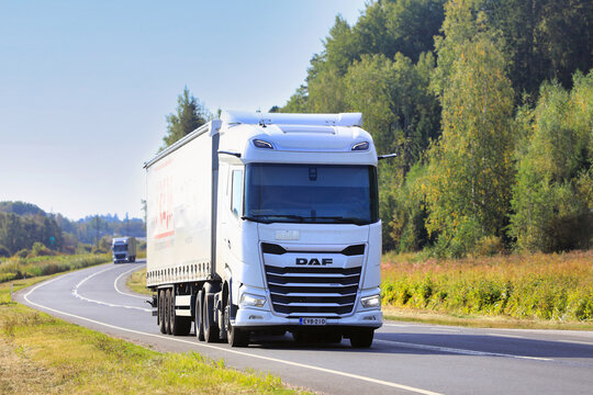 White DAF XG 480 Truck Semi Trailer Transports Goods on Road. 