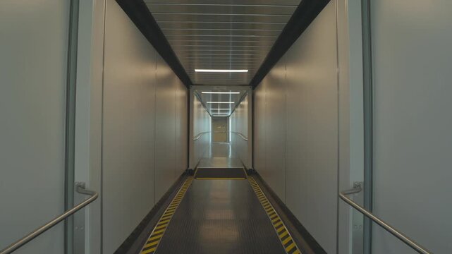 Modern Jet Bridge Interior at Airport Terminal Boarding Gate Walkway for Travel and Aircraft Access