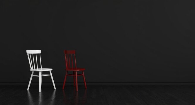 Simple room design with black flooring featuring white and red wood chairs by black wall
