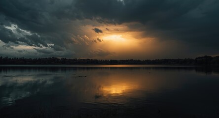 Fototapeta premium Menacing sky with glowing light reflected in still lake