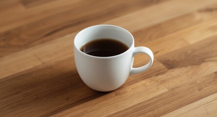 Obraz premium minimalist white cup photographed on a natural rustic wooden table with warm tones
