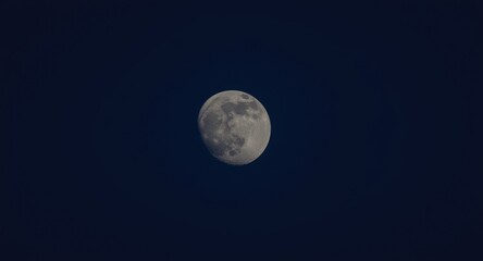 Fototapeta premium Waning gibbous moon phase starts under soft diminishing moonlight