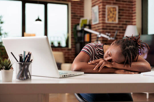 Overworked employee sleeping on table, resting at workplace, sleepy stressed remote worker, professional burnout. Tired student lying on desk, exhausted freelancer oversleeping
