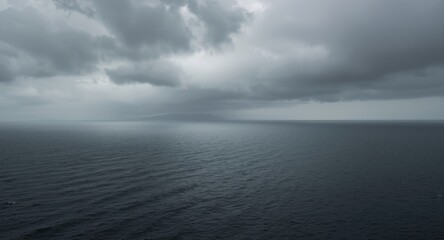 Fototapeta premium High perspective of a gloomy endless sea with dark clouds and steel gray sky