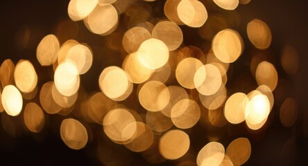Fototapeta premium Scattered blurred lights producing a festive Christmas bokeh scene