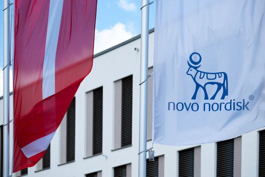 Novo Nordisk advertising flags and logo on facade building, Danish pharmaceutical healthcare giant, production innovative drugs, Ozempic, Mainz, Germany &ndash; June 15, 2024