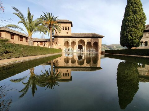 Scenic view of the Partal Palace and reflection in the pool within the Alhambra complex.