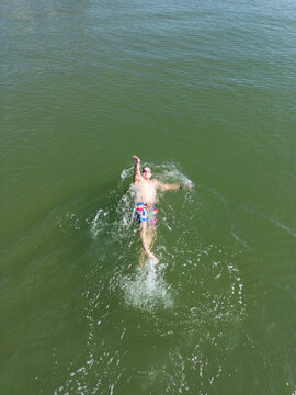 Aerial image of an open water swimmer off Suttons Beach, Redcliffe