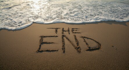 Fototapeta premium Sand art showing THE END with wave motion near shore for presentation or film finale