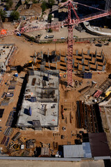 Fototapeta premium Aerial view of construction site with crane and building materials visible