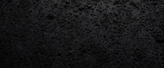 Fototapeta premium Black charcoal powder texture background with fine detailed carbon powder surface and copy space