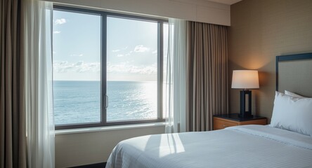 Fototapeta premium Hotel room with large window displaying calm seaside and sunny weather