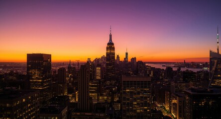 Fototapeta premium City skyline at sunset showcasing tall buildings and vibrant lights