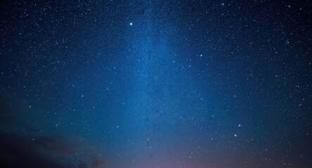 Fototapeta premium A tranquil blue sky showcases a glittering galaxy full of radiant stars