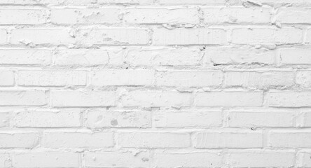 Obraz premium Rough white painted brick wall background showcasing dent texture and diffused lighting