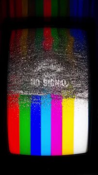 Retro tv screen shows static and 'no signal' text with colorful test pattern bars