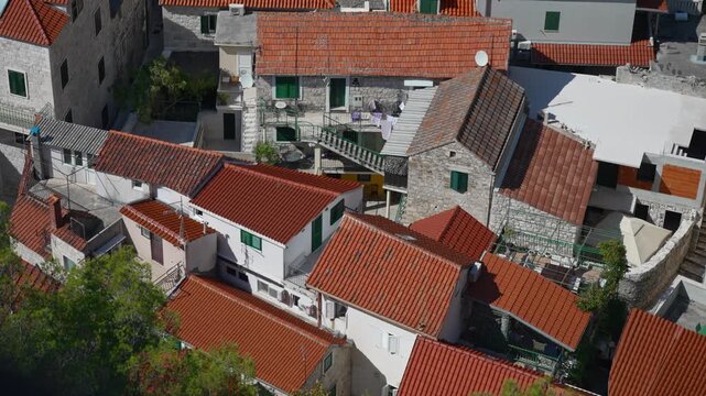 Traditional Mediterranean houses with red clay tile roofs.