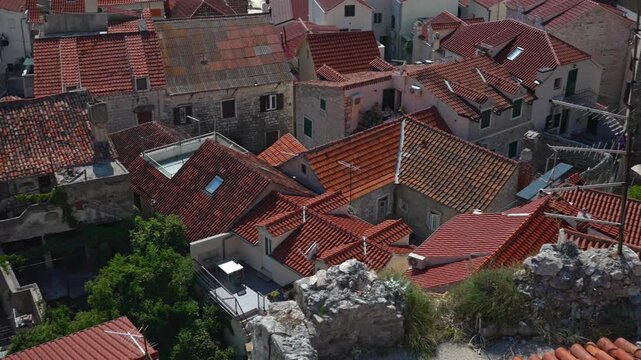 Traditional Mediterranean houses with red clay tile roofs.