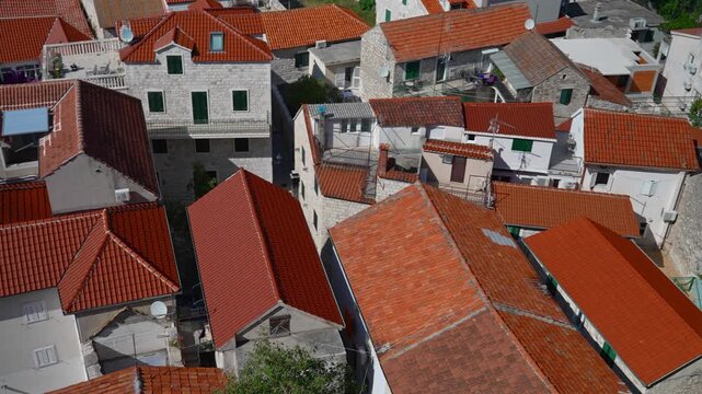 Traditional Mediterranean houses with red clay tile roofs.