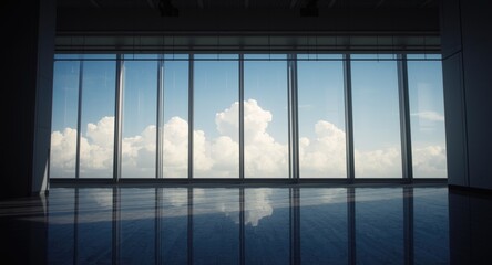 Fototapeta premium Indoor scene bathed in midday light with a broad view featuring a blue sky and cloud details