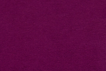 Fototapeta premium Dark purple textured paper background with subtle grain surface and soft structure. Burgundy backdrop, macro