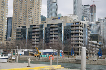 Naklejka premium wide view of Radisson Blu Toronto Downtown, a four star hotel at 249 Queens Quay W (looking east from HTO Park)