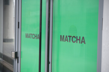 Naklejka premium entrance doors to MATCHA MATCHA, a cafe, located here at 294 Dundas St W, Toronto