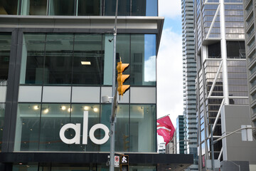 Naklejka premium building facade and sign of ALO, a clothing store, located at 60 Bloor St W, Toronto
