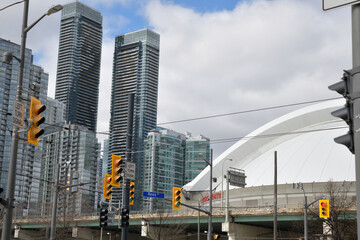 Naklejka premium looking northwest to Rogers Centre, a stadium and to the west cluster of residential towers in the CityPlace area from Queens Quay W and Rees St, Toronto
