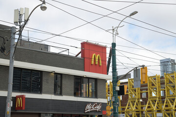 Naklejka premium exterior building and sign of McDonald's, a fast food restaurant, located at 160 Spadina Av, Toronto