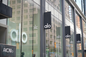 Naklejka premium exterior building facade and sign of ALO, a clothing store, located at 60 Bloor St W, Toronto