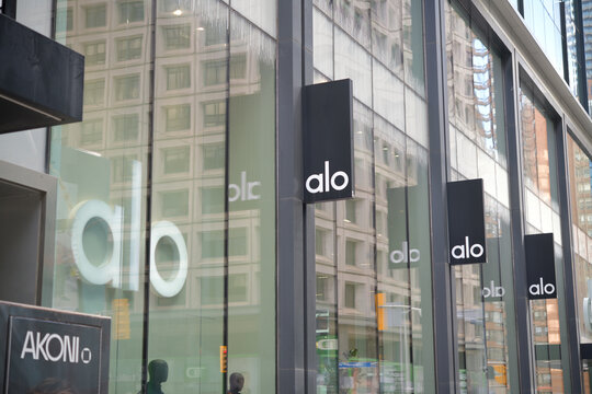exterior building facade and sign of ALO, a clothing store, located at 60 Bloor St W, Toronto