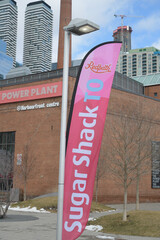 Naklejka premium Redpath Sugar Shack TO feather flag at Harbourfront Centre (14 Mar 2026), Toronto