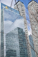 Naklejka premium exterior building reflection and sign of Sun Life Financial (One York Street), Harbour Plaza Residences, and RBC WaterPark Place (abstracted in the windows), Toronto