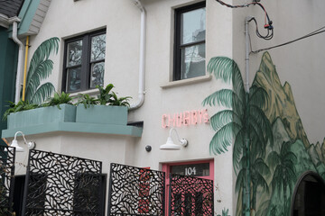 Naklejka premium exterior building facade and sign of Chubby’s Jamaican Kitchen located at 104 Portland Street, Toronto