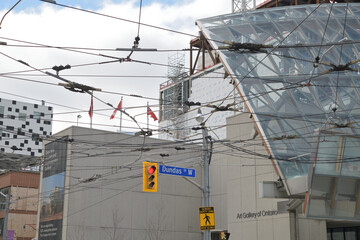 Naklejka premium overhead transit wires and the McCaul St and Dundas St W (or eastern flank) of the Art Gallery of Ontario, Toronto