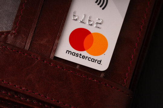 Bishkek, Kyrgyzstan - March 07 , 2020 :   Close-up of a Mastercard credit card tucked into a brown leather wallet.