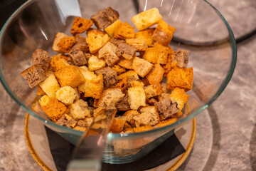 Fototapeta premium Croutons Bread Cubes Toasted Soup Topping Buffet Bowl