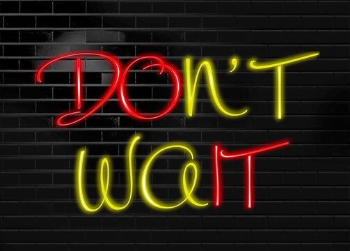 The words "Don't wait" are red and yellow neon lights. The letters "do it" are in red to stand out and get the message through all the yellow.