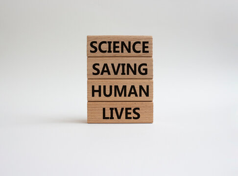 Science symbol. Wooden blocks with words Science saving huma lives. Beautiful white background. Science concept. Copy space