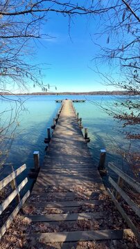 wooden bridge over the lake in idyllic spring season