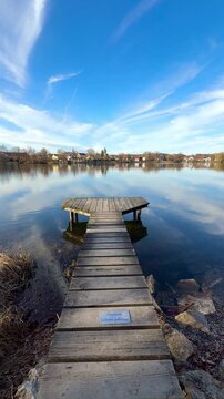 wooden pier on the lake inn sunshine light in spring season