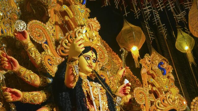Detailed close-up of Goddess Durga face showing vibrant colors and fine artistic craftsmanship.