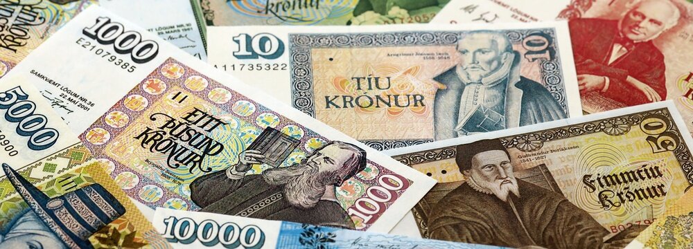 Icelandic krona money bills pile on table. Iceland banknotes of ISK currency close up. Concept of business, economy and banking in Iceland