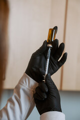 Woman preparing an injection with a small syringe © Amanda