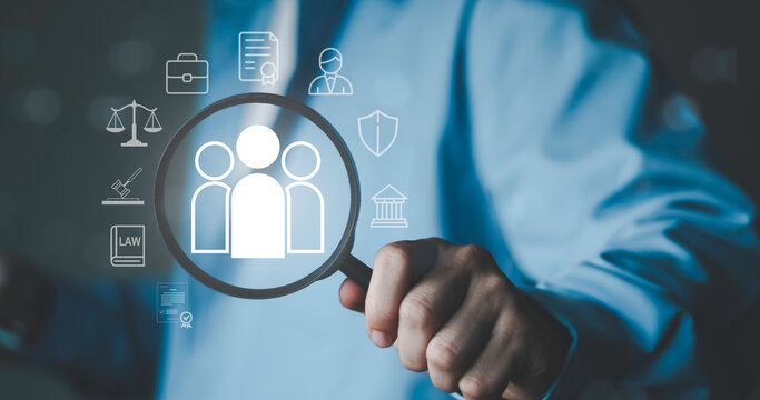Human resource and legal investigation concept with magnifying glass focusing on people icon. Recruitment, background check, compliance audit, legal review and corporate risk management process.