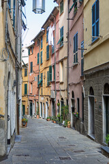 Naklejka premium Alley of a old hamlet. Characteristic main little alley of the medieval hamlet named Portovenere. Liguria, Italy. 