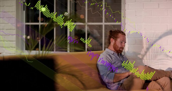 Bearded man glancing at tablet, reading for work and laughing while waveform sweeping office
